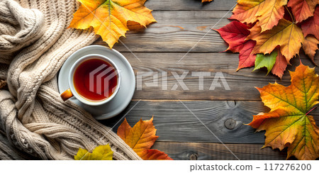 Cozy Autumn Setting with Sweater and Cup of Tea 117276200