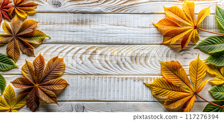 Autumn Background with Chestnut Leaves on White Wood. Top view Autumn Background with Chestnut Leaves on White Wood. Top view 117276394