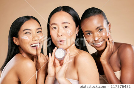 Skincare, portrait and diversity by friends with face cream product in studio for wellness on brown background. Face, model and lotion by women for beauty, different and facial, skin and joy isolated Skincare, portrait and diversity by friends with face cream product in studio for wellness on brown background. Face, model and lotion by women for beauty, different and facial, skin and joy isolated 117276481