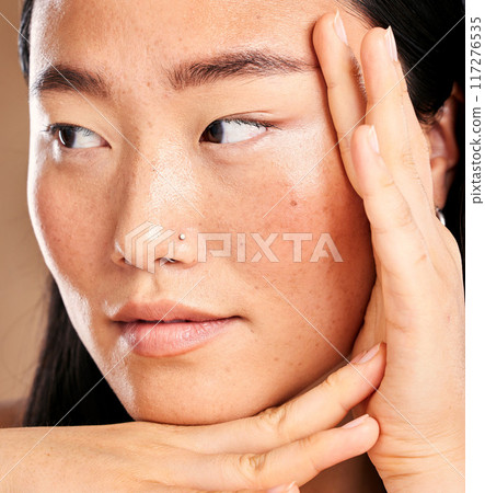 Closeup face, hand frame and asian woman in studio with skincare, skin glow or healthy cosmetics. Happy japanese model, cosmetic beauty and aesthetic with self care health, wellness or natural makeup Closeup face, hand frame and asian woman in studio with skincare, skin glow or healthy cosmetics. Happy japanese model, cosmetic beauty and aesthetic with self care health, wellness or natural makeup 117276535