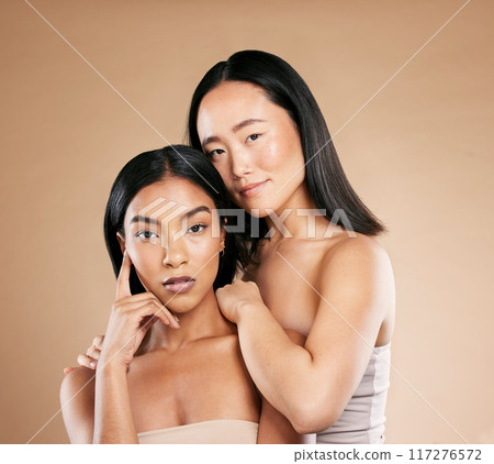 Beauty, makeup and diversity women portrait for skincare in studio with dermatology and cosmetics. Asian and black person together for face glow, spa facial and healthy skin of friends for wellness Beauty, makeup and diversity women portrait for skincare in studio with dermatology and cosmetics. Asian and black person together for face glow, spa facial and healthy skin of friends for wellness 117276572