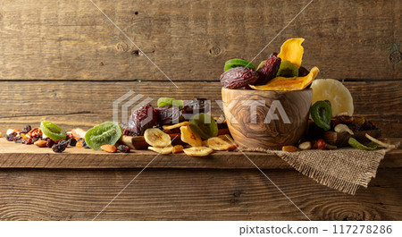 Dried tropical fruits with various nuts and raisins. Dried tropical fruits with various nuts and raisins. 117278286