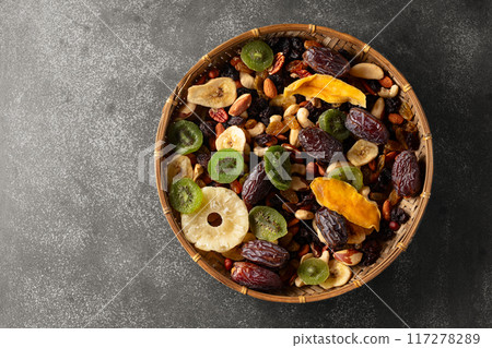 Dried tropical fruits with various nuts and raisins. Dried tropical fruits with various nuts and raisins. 117278289