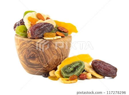 Dried tropical fruits, nuts, and raisins isolated on white. 117278296
