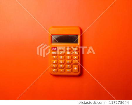 Top view orange calculator on a orange background. 117278644