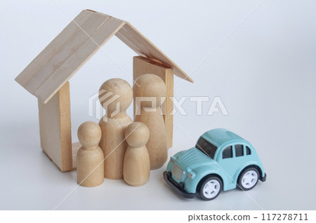 Insurance concept with family figure, blurred car background Insurance concept with family figure, blurred car background 117278711