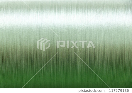 Closed up of green color of thread textured background (Focus at center of picture) Closed up of green color of thread textured background (Focus at center of picture) 117279186