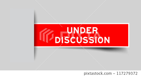 Red color square label sticker with word under discussion that inserted in gray background 117279372