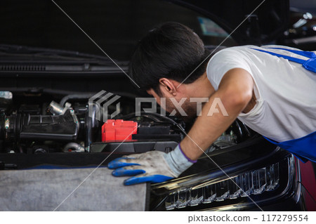 Transportation repair service concept, Repairman auto mechanic check for damage inside engine. Transportation repair service concept, Repairman auto mechanic check for damage inside engine. 117279554