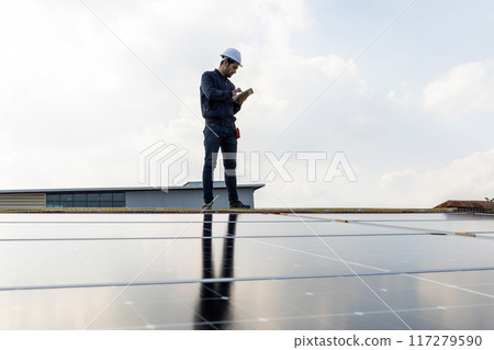 Engineer service check installation solar cell on the roof of factory. Engineer service check installation solar cell on the roof of factory. 117279590