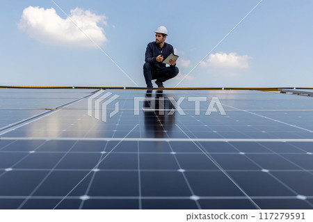 Engineer service check installation solar cell on the roof of factory. 117279591