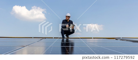 Engineer service check installation solar cell on the roof of factory. 117279592