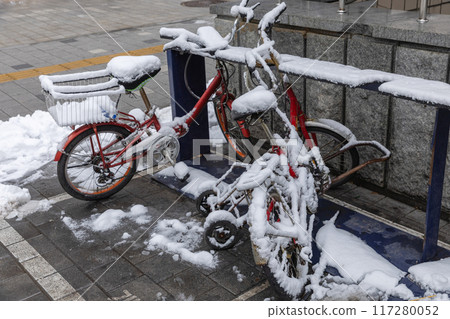 Bike covered with fresh snow 117280052
