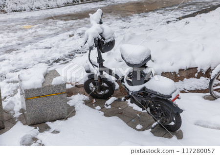 Bike covered with fresh snow 117280057