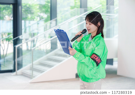 Event staff providing guidance with a smile Event staff providing guidance with a smile 117280319