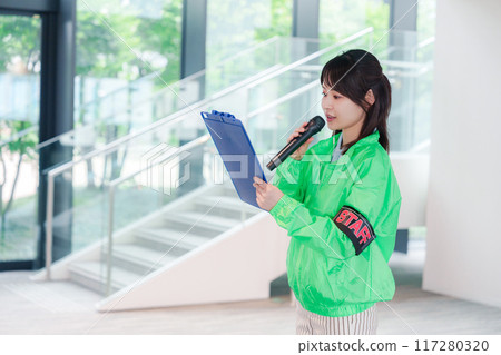 Event staff providing guidance with a smile 117280320