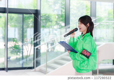 Event staff providing guidance with a smile Event staff providing guidance with a smile 117280322