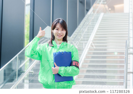 Event staff providing guidance with a smile 117280326