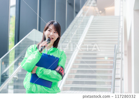 Event staff providing guidance with a smile 117280332