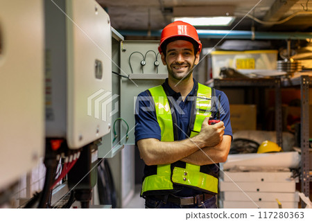 Electrical engineer man checking Power Distribution Cabinet in the control room Electrical engineer man checking Power Distribution Cabinet in the control room 117280363