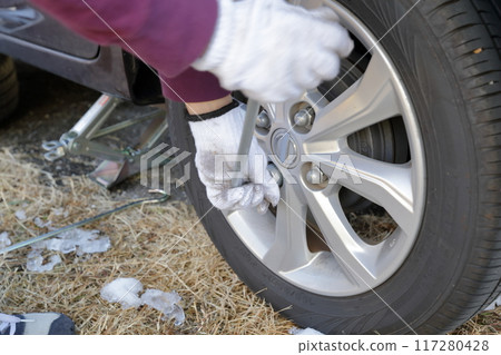 Replacing winter tires of a private car (studless tires) Replacing winter tires of a private car (studless tires) 117280428