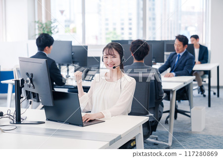Young businesswoman speaking with a headset Young businesswoman speaking with a headset 117280869