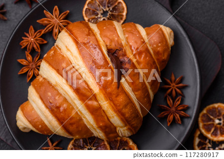 Delicious crispy sweet croissant cornet with chocolate 117280917