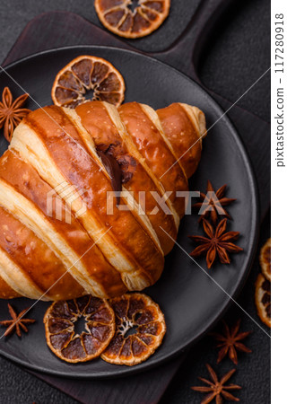 Delicious crispy sweet croissant cornet with chocolate 117280918