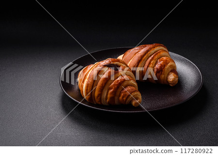 Delicious crispy sweet croissant cornet with chocolate Delicious crispy sweet croissant cornet with chocolate 117280922