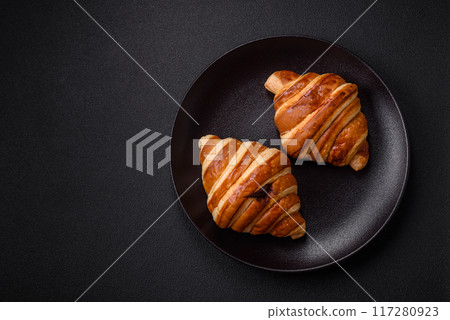 Delicious crispy sweet croissant cornet with chocolate Delicious crispy sweet croissant cornet with chocolate 117280923