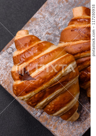 Delicious crispy sweet croissant cornet with chocolate Delicious crispy sweet croissant cornet with chocolate 117280938