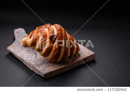 Delicious crispy sweet croissant cornet with chocolate Delicious crispy sweet croissant cornet with chocolate 117280942