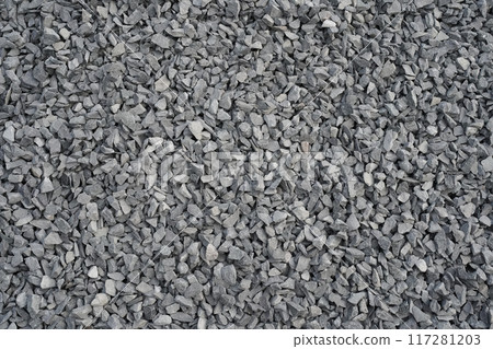 Grey background with crushed stone. Small broken stone with sharp edges, several shades of grey, as a substrate for graphics and design. Place, space for text. Grey background with crushed stone. Small broken stone with sharp edges, several shades of grey, as a substrate for graphics and design. Place, space for text. 117281203