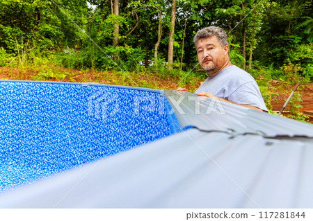 In backyard of house, we are assembling construction ground swimming pool 117281844