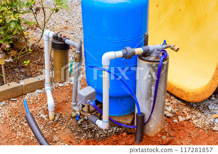 PVC water pipe is being connected to water supply artesian well system pump house PVC water pipe is being connected to water supply artesian well system pump house 117281857