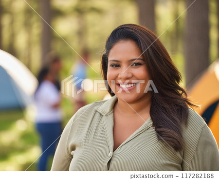 Joyful Moments in Nature: Happy Woman Enjoying Camping Adventure 117282188