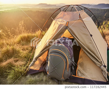 Scenic Campsite Setup in a Forested Wilderness 117282445