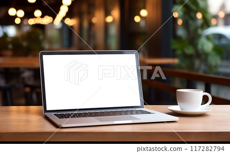 Laptop blank screen on table in cozy coworking space, remote work or freelancing concept 117282794