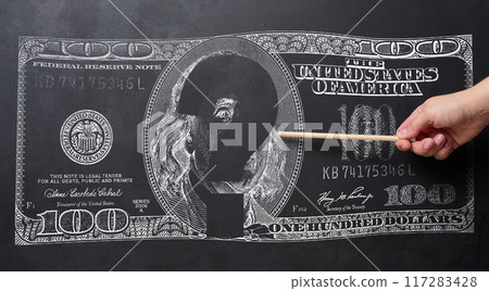 A chalk drawing of a US hundred dollar bill and a hand holding a pencil, a concept of uncertainty in the global or national economy A chalk drawing of a US hundred dollar bill and a hand holding a pencil, a concept of uncertainty in the global or national economy 117283428