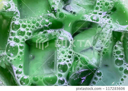 texture of refreshing tea with transparent ice cubes and bubbles texture of refreshing tea with transparent ice cubes and bubbles 117283606