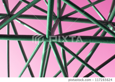 Abstract metal figure on a colorful pink background, artistically welded metal pipes, fragment of scaffolding in NYC Abstract metal figure on a colorful pink background, artistically welded metal pipes, fragment of scaffolding in NYC 117283824