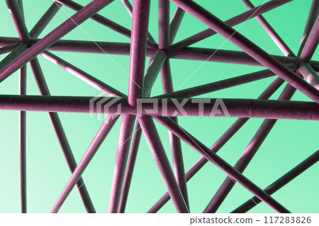 Abstract metal figure on a colorful pink background, artistically welded metal pipes, fragment of scaffolding in NYC 117283826