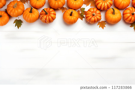 Ripe pumpkins on white wooden table top view 117283866