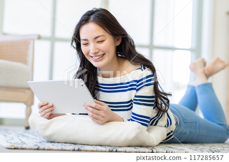 Young woman living alone Young woman living alone 117285657