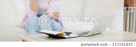 Young asian woman calculating expenses household about finance and frustrated at home. Young asian woman calculating expenses household about finance and frustrated at home. 117285835
