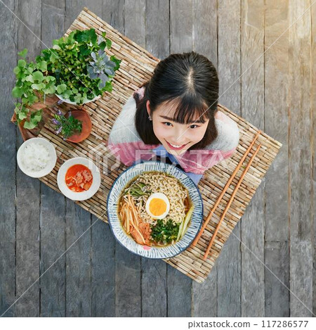 Ramen, a girl and giant chopsticks 117286577