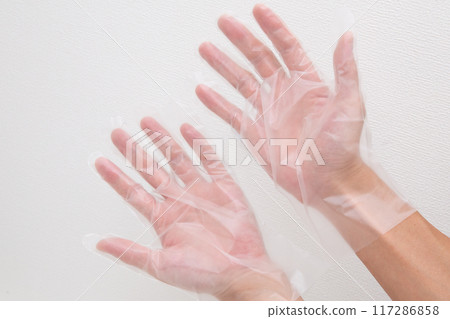 Put on polyethylene gloves 117286858