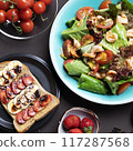 A vibrant, tempting breakfast with colorful salad, shrimp, ripe tomato, sandwich, bananas, fresh strawberries. Wholesome meal offers a delicious nutrients, providing energy, essential vitamin, healthy 117287568