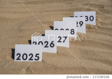 Paper cards with numbers of years from 2024 to 2030 in a row. New year start concept. Resolution time is flying plan goal motivation Paper cards with numbers of years from 2024 to 2030 in a row. New year start concept. Resolution time is flying plan goal motivation 117290100