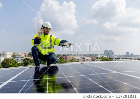 Engineer service check installation solar cell on the roof of factory Engineer service check installation solar cell on the roof of factory 117291831